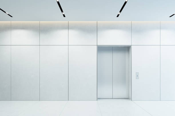 modern elevator with closed doors in office lobby stock photo