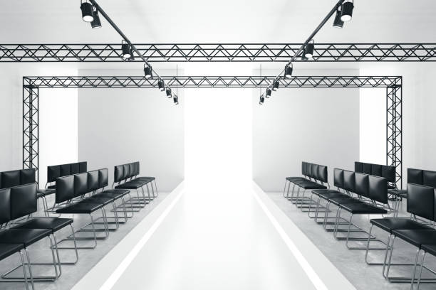 Modern empty fashion runway Modern empty fashion runway podium stage interior with seats, lights and copyspace. 3D Rendering fashion runway stock pictures, royalty-free photos & images