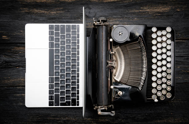 Modern Laptop Computer with Antique Typewriter Top viw of Modern Laptop Computer with Antique Typewriter on wooden table old vs new stock pictures, royalty-free photos & images