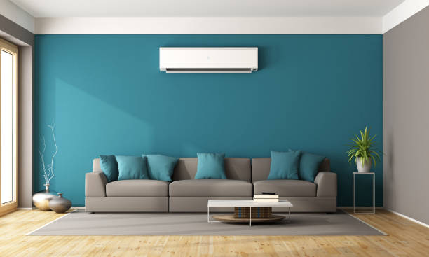 Modern living room with air conditioner stock photo