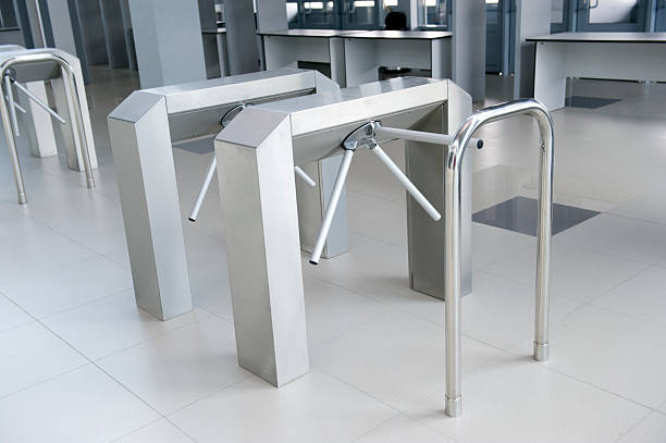 Modern new turnstile with silver handrails stock photo