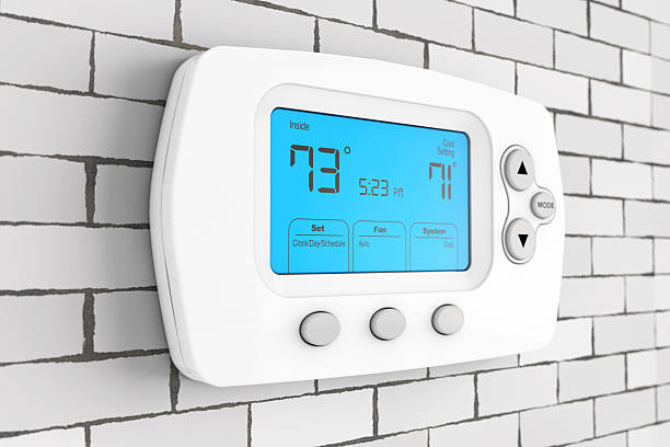 Modern Programming Thermostat. 3d Rendering Modern Programming Thermostat in front of Brick Wall. 3d Rendering. fahrenheit stock pictures, royalty-free photos & images