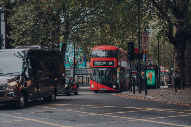 Modern red double decker bus 19 to Battersea on a road in Islington, London, UK. stock photo