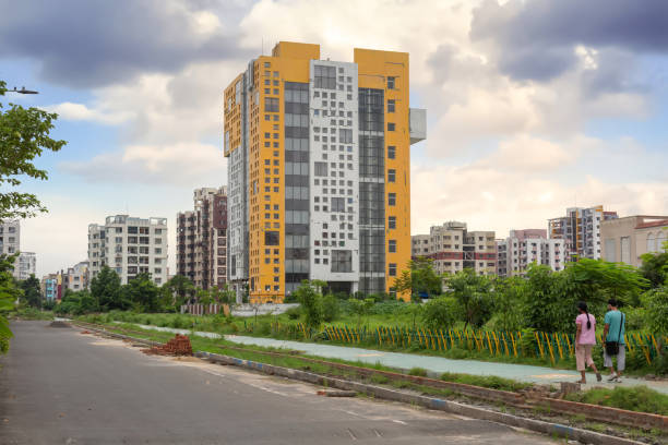 Modern residential apartment buildings with city road at New Town, Rajarhat, Kolkata at sunset stock photo