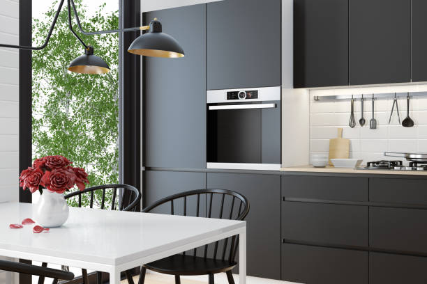 Modern Scandinavian black kitchen and dining room stock photo