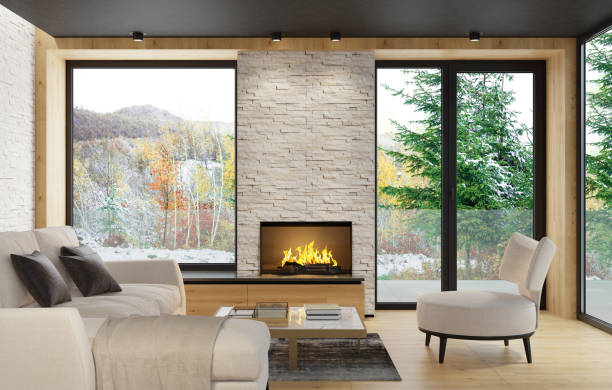 Modern Scandinavian style country villa light minimalist interior with fireplace and white slate rock wall stock photo