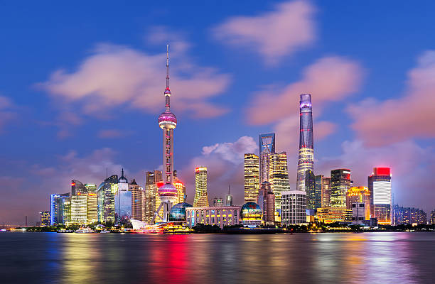 Modern Shanghai Skyline Twilight shot with the Shanghai skyline along the Huangpu river, China shanghai stock pictures, royalty-free photos & images