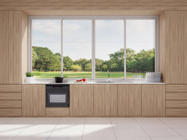 Modern style wooden kitchen with nature view 3d render Modern style wooden kitchen with nature view 3d render,The rooms have white tile floors, Big windows overlooking a large garden, sunlight into the room. sliding stock pictures, royalty-free photos & images