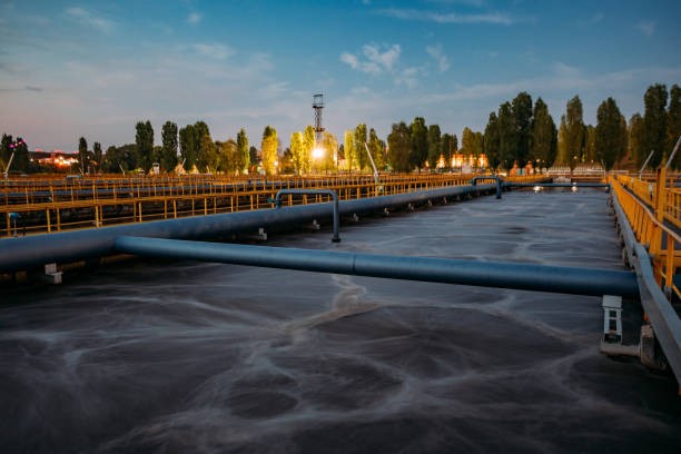 Modern wastewater treatment plant. Tanks for aeration and biological purification of sewage at sunset stock photo