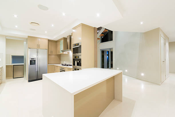 Modern white kitchen in new luxurious home stock photo