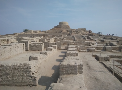 A wide distance shot of Brick walls, streets, common bath and budhist stupa of old city of mohenjo daro.