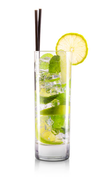 Mojito cocktail in classic glass isolated on white Mojito cocktail in classical glass with slice of lemon and tube isolated on white background with clipping path vodka soda stock pictures, royalty-free photos & images