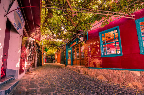 Molivos- the picteresque stone alley with the traditional shops which it was voted as the nicest alley of the world. stock photo