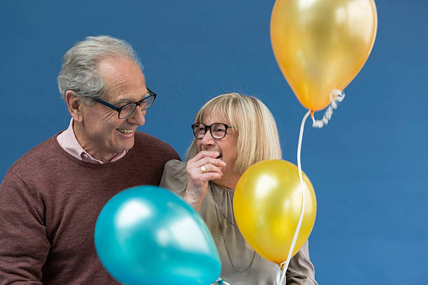 Moment of complicity and joy of a couple of senior stock photo