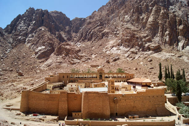 Monastery of St. Catherine, Sinai Monastery of St. Catherine Sinai (one of the oldest working Christian monasteries in the world) located a stony valley between the rocks. Noon. General view from above shot from the mountainside. coptic christianity stock pictures, royalty-free photos & images