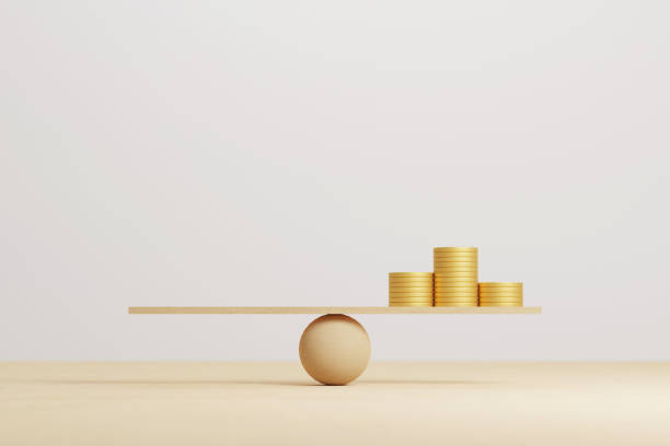 Money coin stack on wood scale seesaw and copy space. Save money and investment. Compare balance concept. 3d illustration stock photo