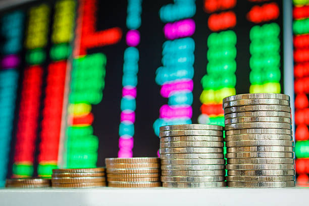 Money coins and Stock market. Money coins and Stock market in thai. Dow Futures  stock pictures, royalty-free photos & images