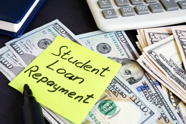 Money for Student Loan Repayment on a table. Money for Student Loan Repayment on a table. student debt stock pictures, royalty-free photos & images