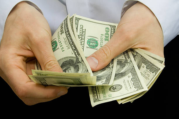 money in the hands  counting stock pictures, royalty-free photos & images