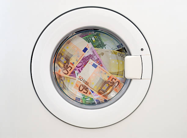 Money laundering Euro money laundering in the washing machine money laundering stock pictures, royalty-free photos & images