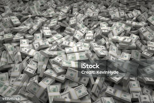 istock Money Pile Bundles of $100 USD Notes 492595743