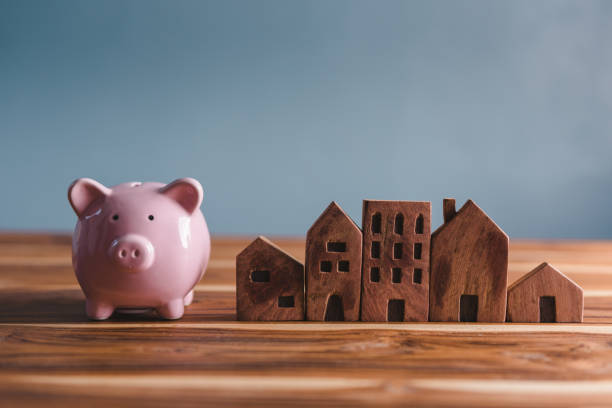 Money Savings for Future Property House Concept, Piggy Bank and Housing Community. Ownership. Banking Fund for Investing House Asset and Real Estate. Saving and Banking for Future Retirement stock photo