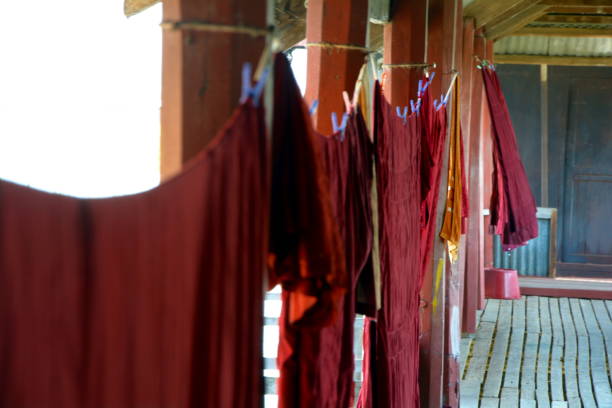 Monks clothes hang on a sunny day, Inle, Myanmar stock photo