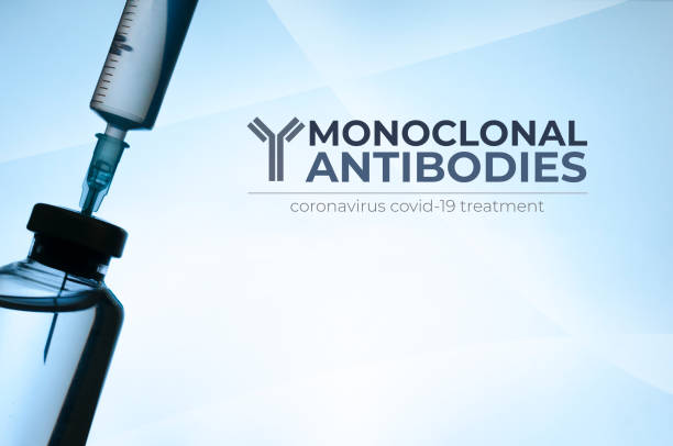 Monoclonal antibodies concept image: vial and syringe silhouette on light blue background Monoclonal antibodies concept image: vial and syringe silhouette on light blue background antibody photos stock pictures, royalty-free photos & images
