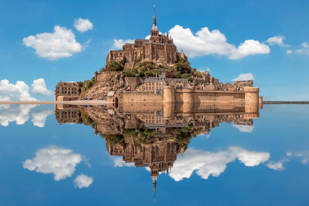 Mont St Michel in daytime Mont-Saint-Michel, an UNESCO world heritage site in Normandy, France unesco world heritage site stock pictures, royalty-free photos & images