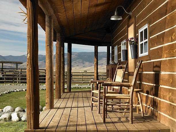 USA, Montana, Bozeman, chairs on porch of cabin  ranch stock pictures, royalty-free photos & images