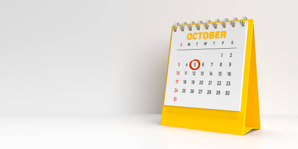 Special days concept: Important holidays and events marked in red on a white and yellow monthly desktop calendar for 2021. A modern reminder to prepare for that extra day. White background with large blank space for additional text message.