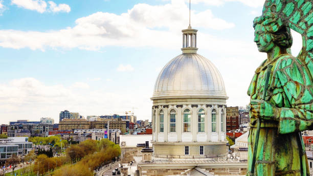 Montreal elevated view of the old town with a 19th century angel statue in the foreground Montreal elevated view of the old town with a 19th century angel statue in the foreground cupola stock pictures, royalty-free photos & images