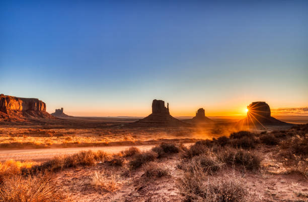 Monument Valley in Navajo National Park at Sunrise, Border of Utah and Arizona, USA stock photo