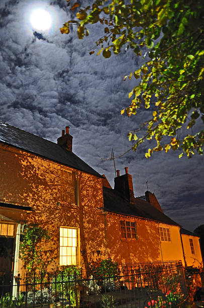 Moonlight in Stourport Taken in Stourport when the moon was bright behind light cloud the effect lit up the sky, with street lighting falling on the houses. normalisaverage stock pictures, royalty-free photos & images