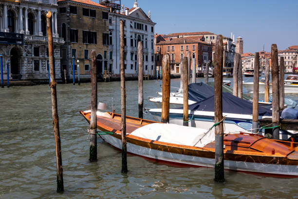 Moored boats in a Venice canal stock photo
