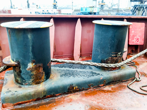 Mooring bollard on the decks of an industrial seaport