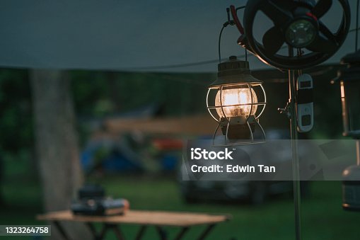 istock morning electric lamp hanging in camping tent light up 1323264758