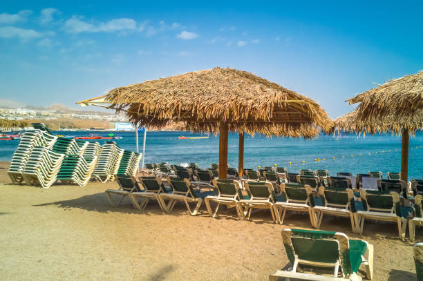 Morning on sandy beach of the Red Sea in Eilat stock photo