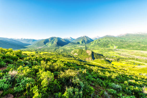 Morning sunrise high wide angle view from Sunnyside Trail in Aspen, Colorado in Woody Creek neighborhood in 2019 summer with roaring fork valley Morning sunrise high wide angle view from Sunnyside Trail in Aspen, Colorado in Woody Creek neighborhood in 2019 summer with roaring fork valley aspen tree stock pictures, royalty-free photos & images