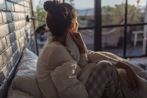 Mornings Portrait of a young beautiful woman waking up with a morning sunlight waking up stock pictures, royalty-free photos & images