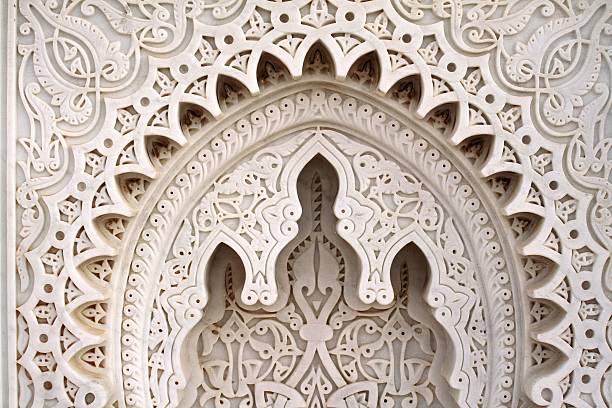 Moroccan geometries Arabesque pattern carved in the marble at the Mausoleum of Mohammed V. Rabat, Morocco. middle eastern culture stock pictures, royalty-free photos & images