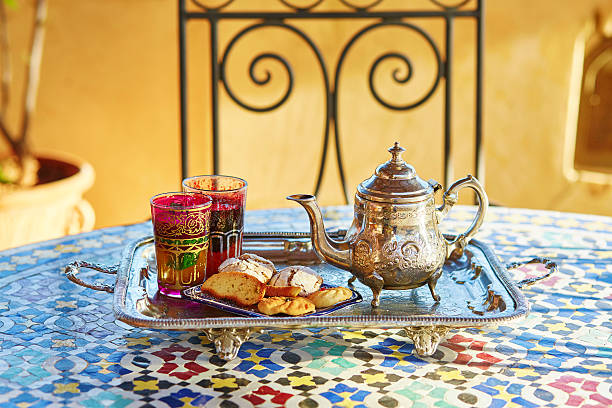 Moroccan mint tea with sweets Traditional Moroccan mint tea with sweets fez morocco stock pictures, royalty-free photos & images