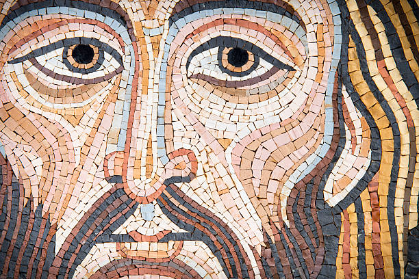 Mosaic: Christ's Face Mosaic representing Christ's Face, in byzantine style. Golden background. It is modern, made by a Sicilian artist, and looks like the Blessing Christ of the Monreale Cathedral or Cefalu' one. The background is made of golden leaf. This image is characteristic for its uniqueness.   byzantine stock pictures, royalty-free photos & images