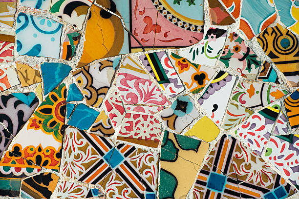 Mosaic of broken tiles Mosaic of broken tiles in the Parc Guell in Barcelona (Catalonia, Spain). The Parc Guell was designed by Antonio Gaudi and is declared as a World Heritage Site by the UNESCO. antoni gaudí stock pictures, royalty-free photos & images