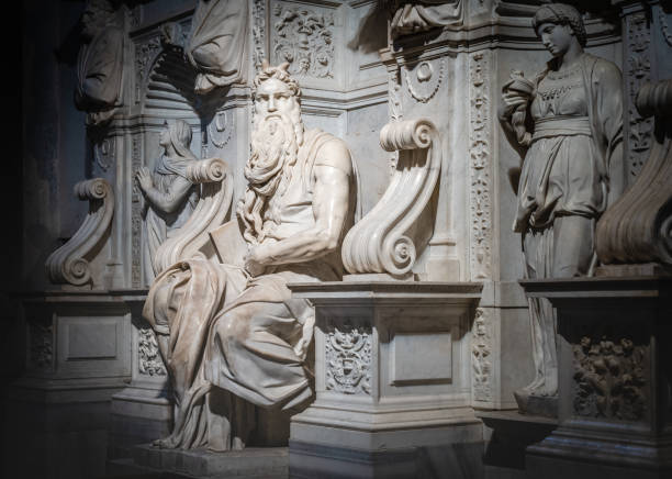 Moses, Renaissance sculpture by Michelangelo Buonarroti Rome, Italy - December 12, 2018: Moses, 1515 Italian High Renaissance Carrara marble sculpture by Michelangelo Buonarroti, housed in the church of San Pietro in Vincoli with vignetting effect michelangelo artist stock pictures, royalty-free photos & images