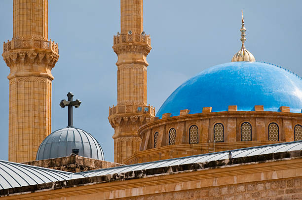 Mosque and church juxtaposed in Beirut, Lebanon The rooftops of the St. George Orthodox Cathedral and the Mohammad Al-Amin Mosque minutes after a rainstorm in Beirut, Lebanon minaret stock pictures, royalty-free photos & images