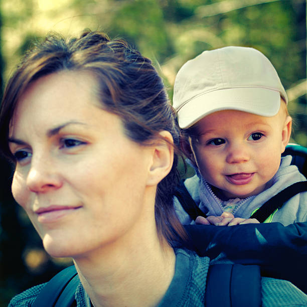 Mother and baby hiking stock photo