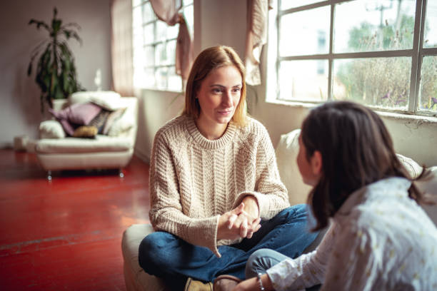 Mother and daughter having a talk. stock photo