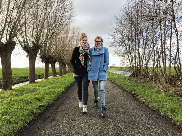 Mother and daughter having a walk Mother and daughter having a walk in the Dutch polder dutch culture stock pictures, royalty-free photos & images