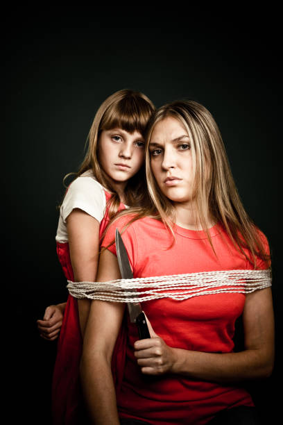 mother and daughter tied up with rope - bad bangs stock photos and pictures...